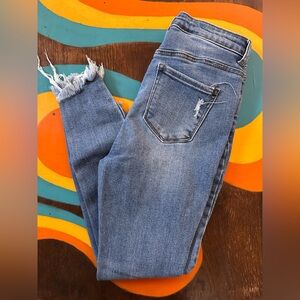 Wax distressed skinny jeans